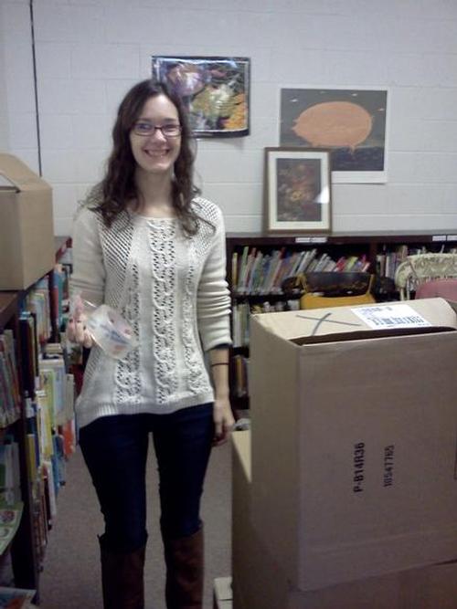 Children’s Library Staff Member, Sam, getting ready to pack.