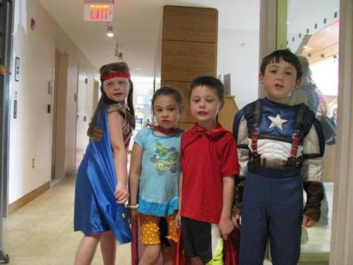 A whole bunch of super heroes at Super Hero Night at the library June 26, 2015.