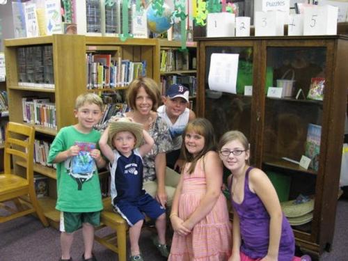 Summer Reading - Christine Bailey, a Title I teacher, reads with Zachery May, Jack and Cooper Sonnabend, Brooke Reynolds, and Sarah Lyon.