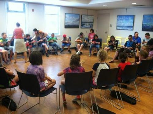 Children are learning ukulele tunes taught by Julie Calamine. This program was funded in part by the Friends of the APL & a grant from the Athol Cultural Council.