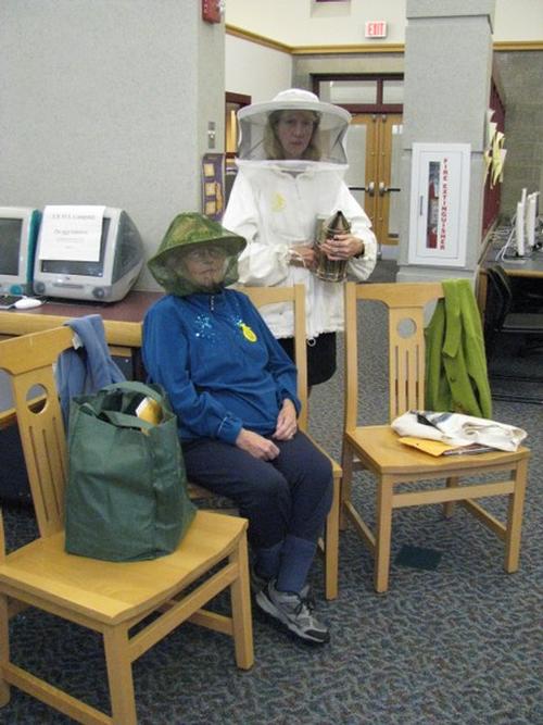 Community Reading Day 2010 - Priscilla Holden and Jean Shaughnessy model the appropiate garb for handling bees.