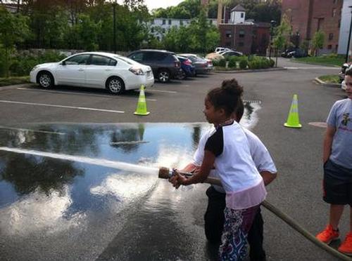 Build a Better World: The Athol Fire Department let children spray the fire hose.