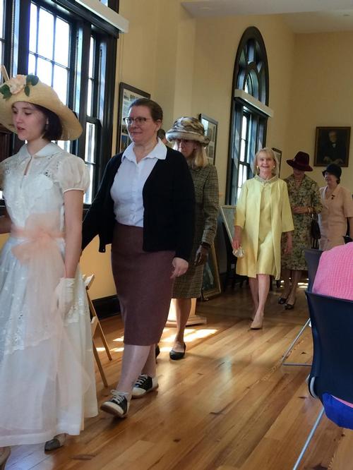 A fashion show of clothing of the past 100 years.