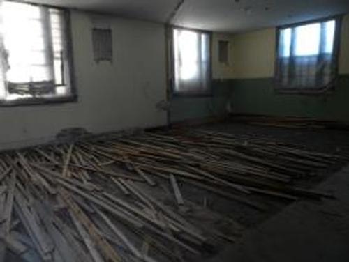 Children’s Room floor boards being removed.