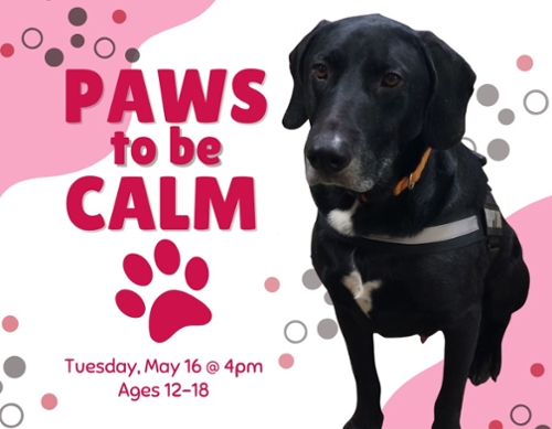 Hunter the black dog next to a cartoon pink paw.